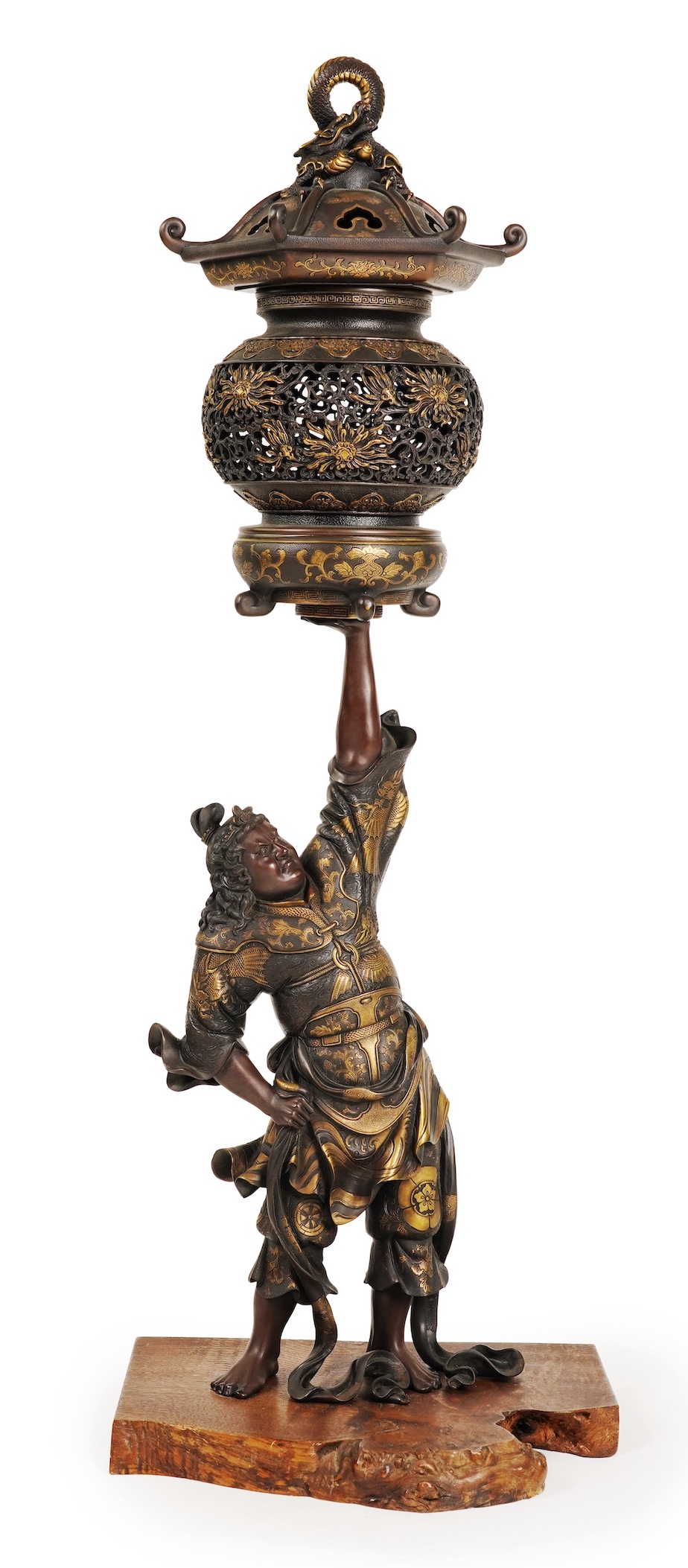 A large Japanese Miyao style parcel gilt bronze figure holding a koro aloft, 20th century